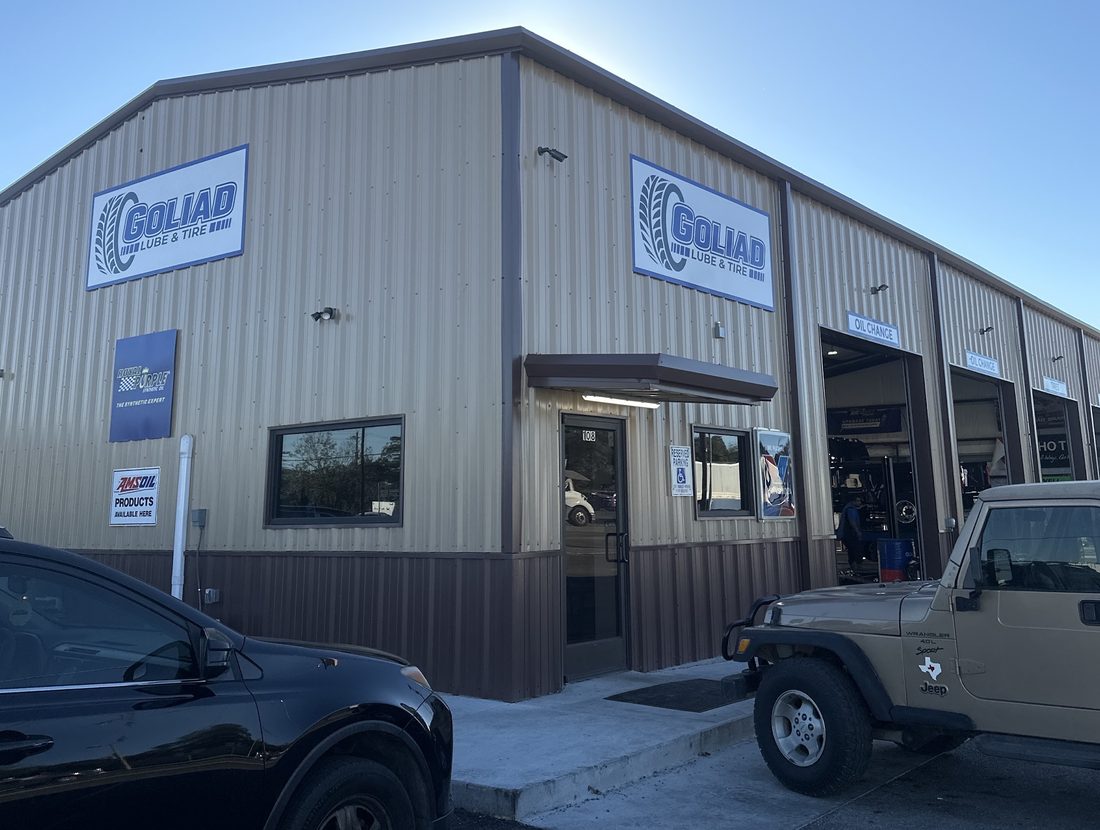 The Goliad Lube and Tire building on South Jefferson Street, its sign above the service bays.