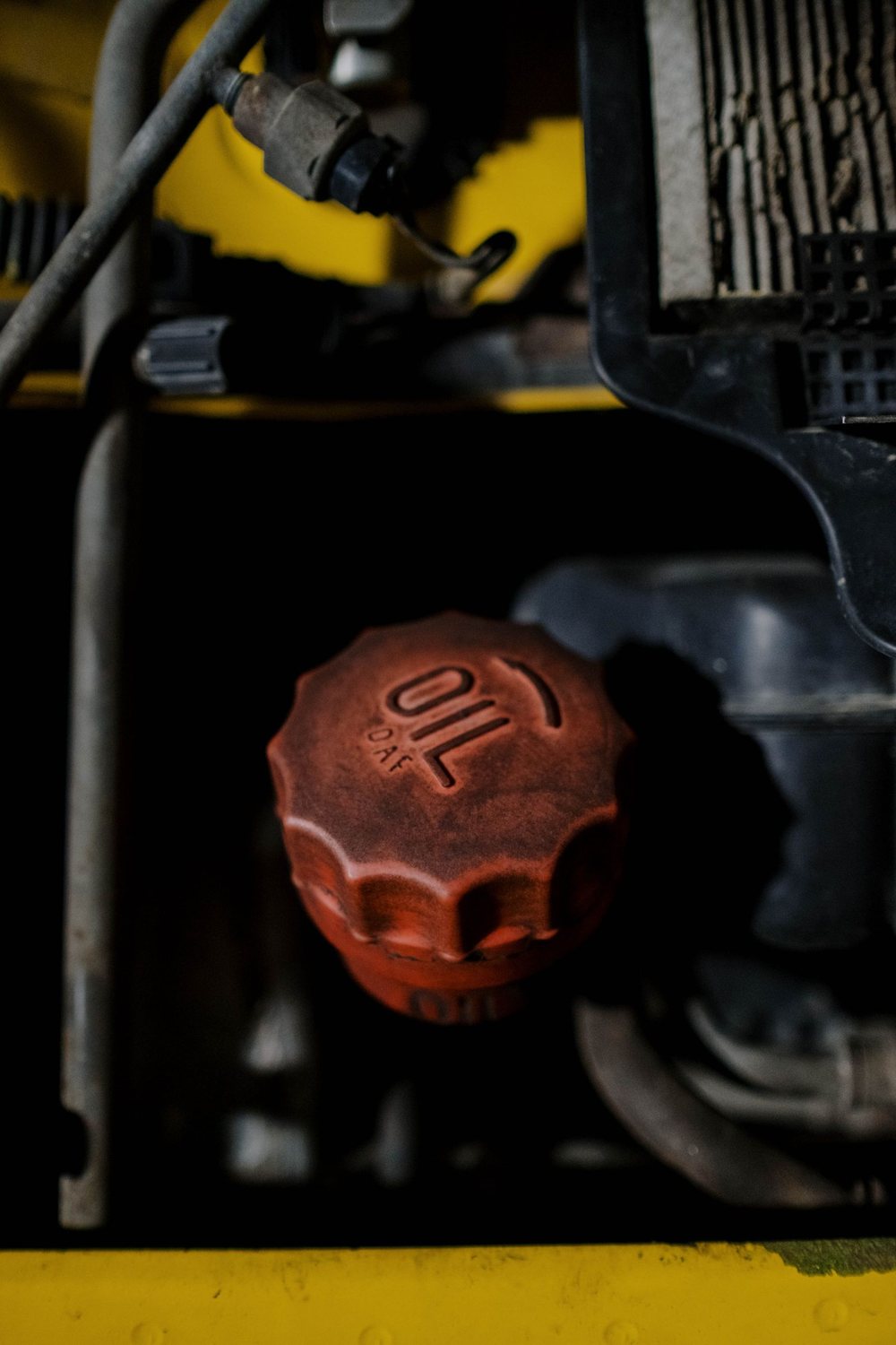Licensed stock photograph: a red engine oil filler cap.
